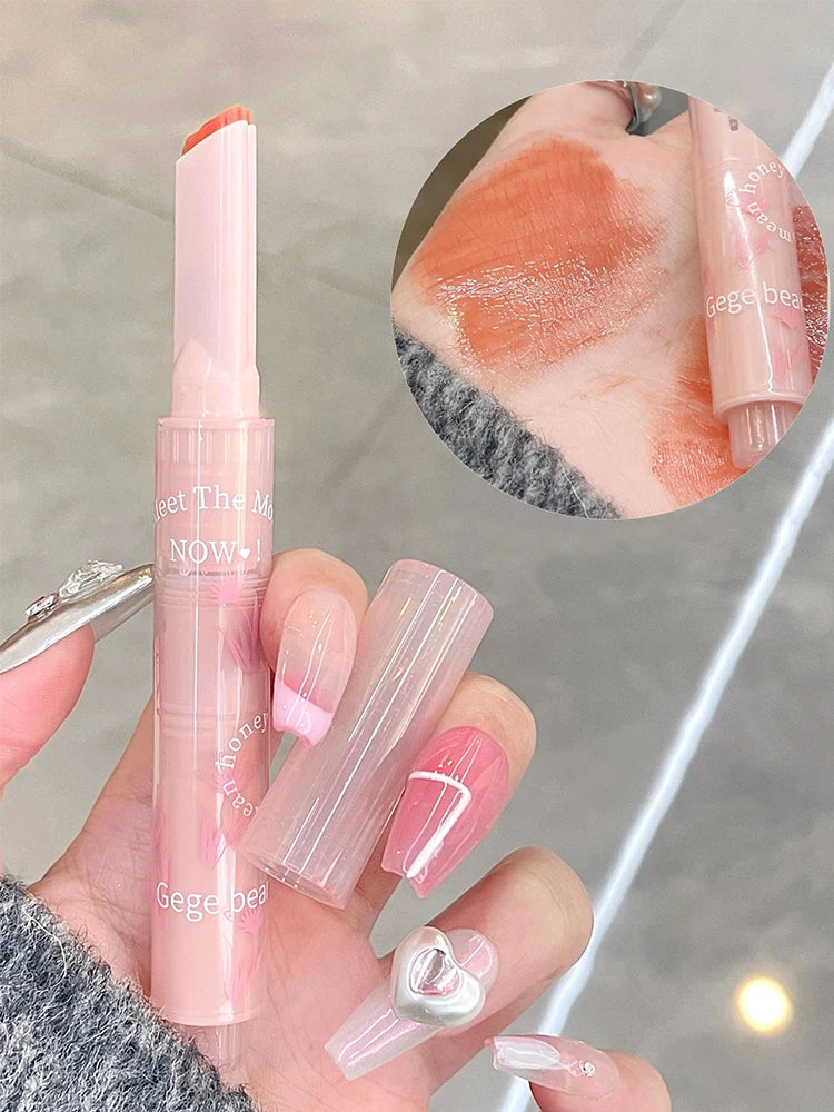 Gege Bear Floral Whisper lipstick with a glossy jelly finish, heart-shaped bullet, and orange-tinted swatch.