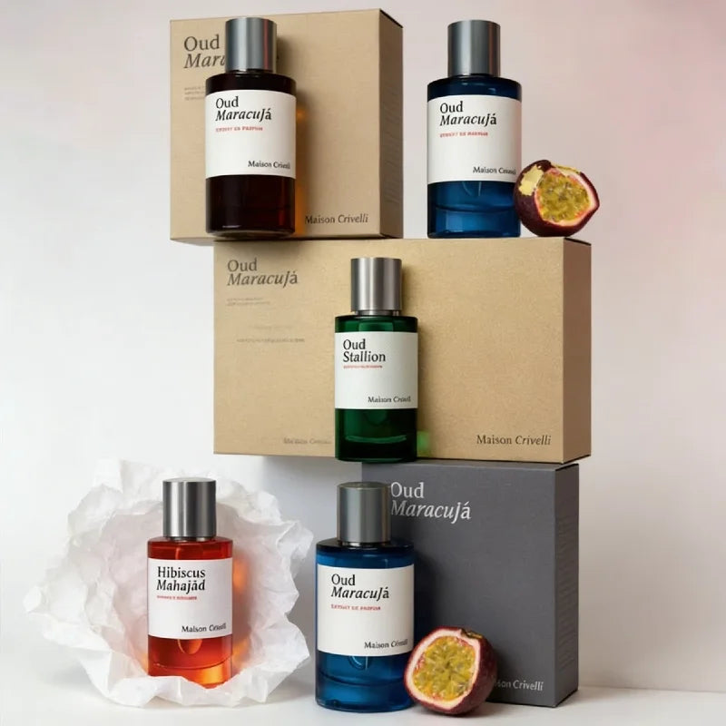 Maison Crivelli Oud Maracuja unisex Extrait de Parfum in cylindrical glass bottles with passion fruit notes.
