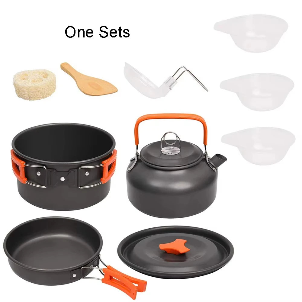 Aluminum camping cookware set with black pot and kettle and nested white bowls