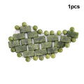 Natural green jade stone eye mask for cooling massage and relaxation, featuring rectangular tiles and beaded edges.