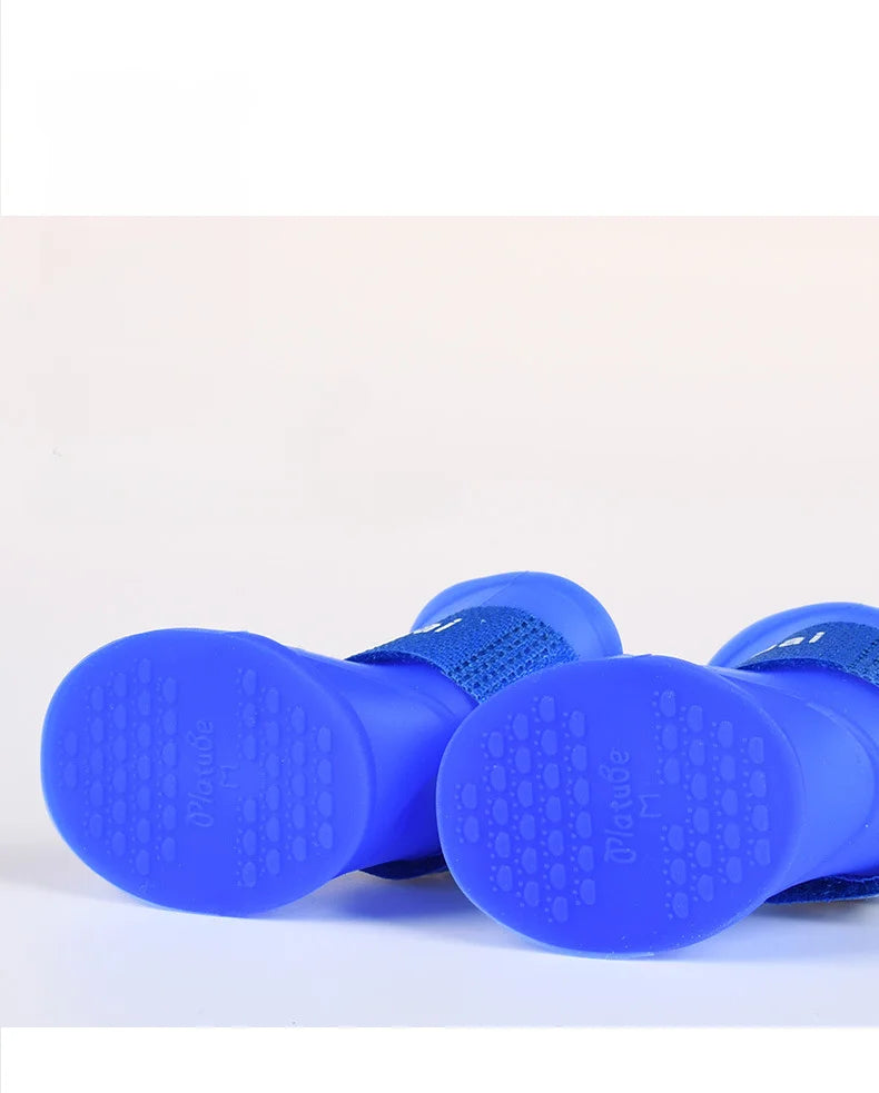 Blue waterproof dog rain boots, size M, with soft non-slip soles for safe outdoor pet walking.