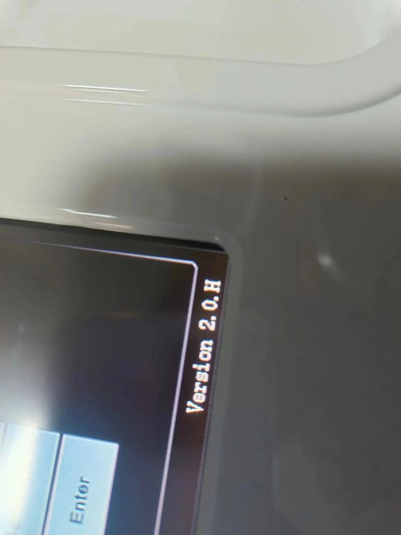 Close-up of a white HIFU machine's digital screen displaying "Version 2.0.H" and an "Enter" button.