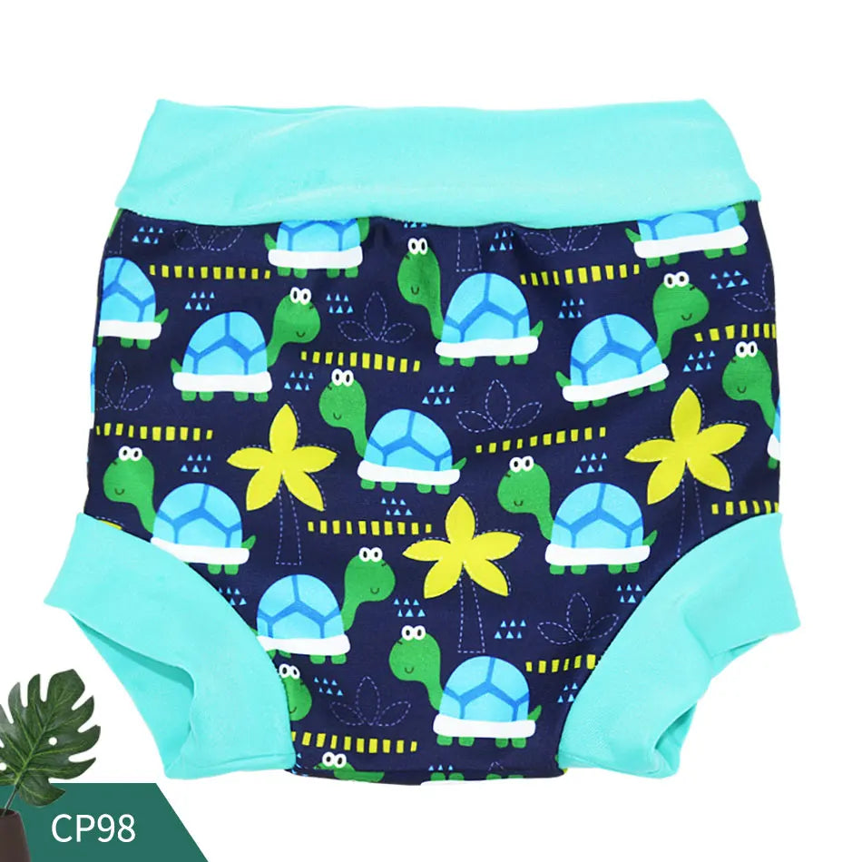 Reusable swim diaper with blue and green turtle and palm tree print.