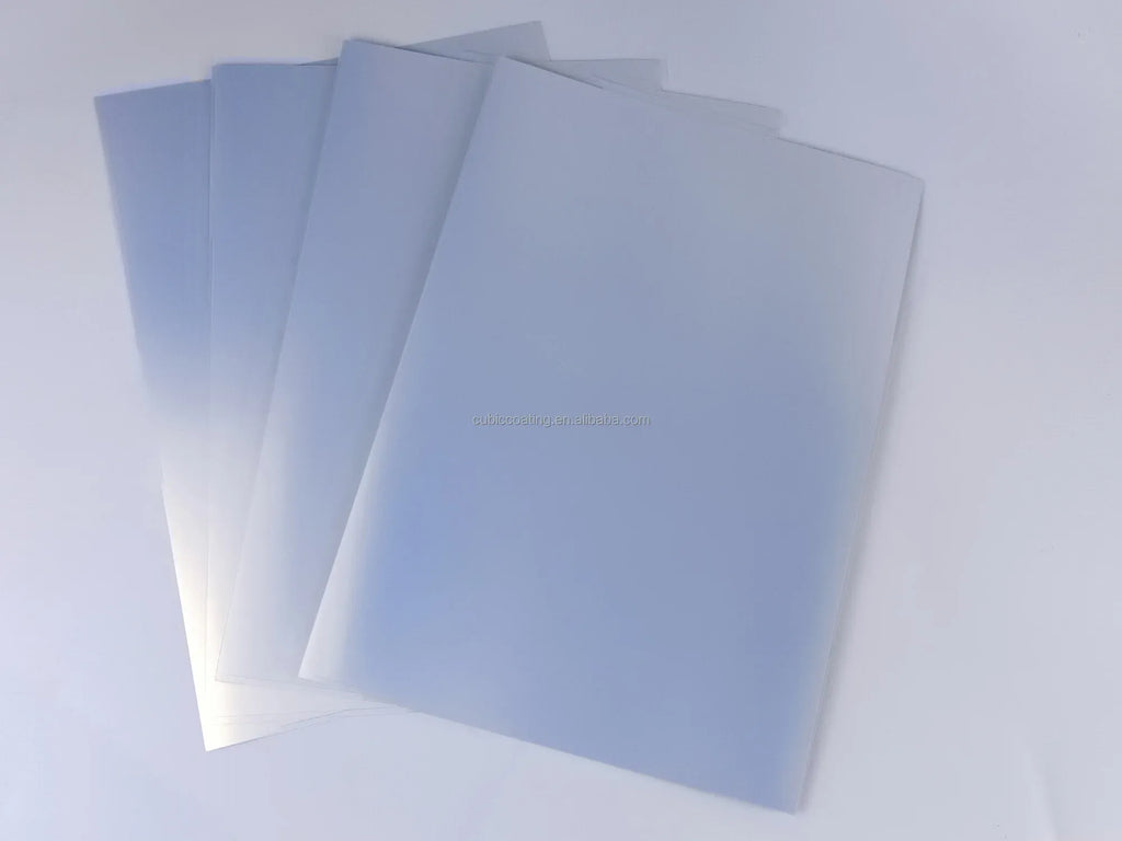 Silver-toned printable vinyl sheets stacked, smooth matte finish.