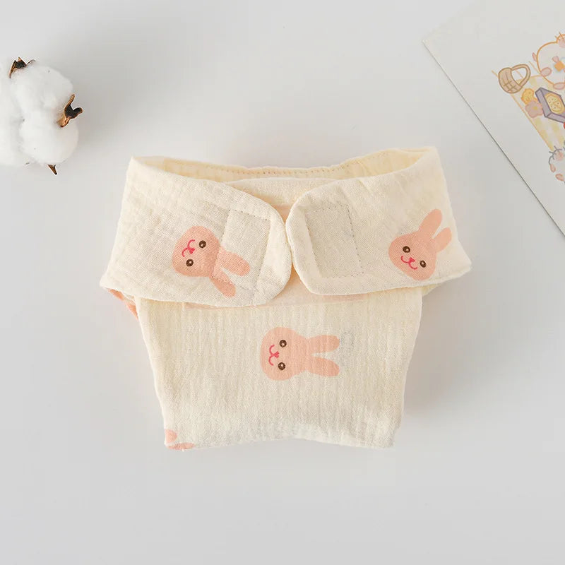 Baby care muslin cloth diaper with cute bunny print and adjustable velcro straps for infants.