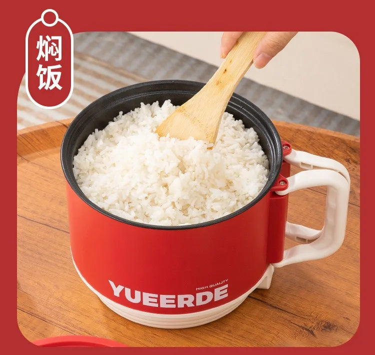 Red YUEERDE electric hot pot filled with white rice, wooden spoon resting on top