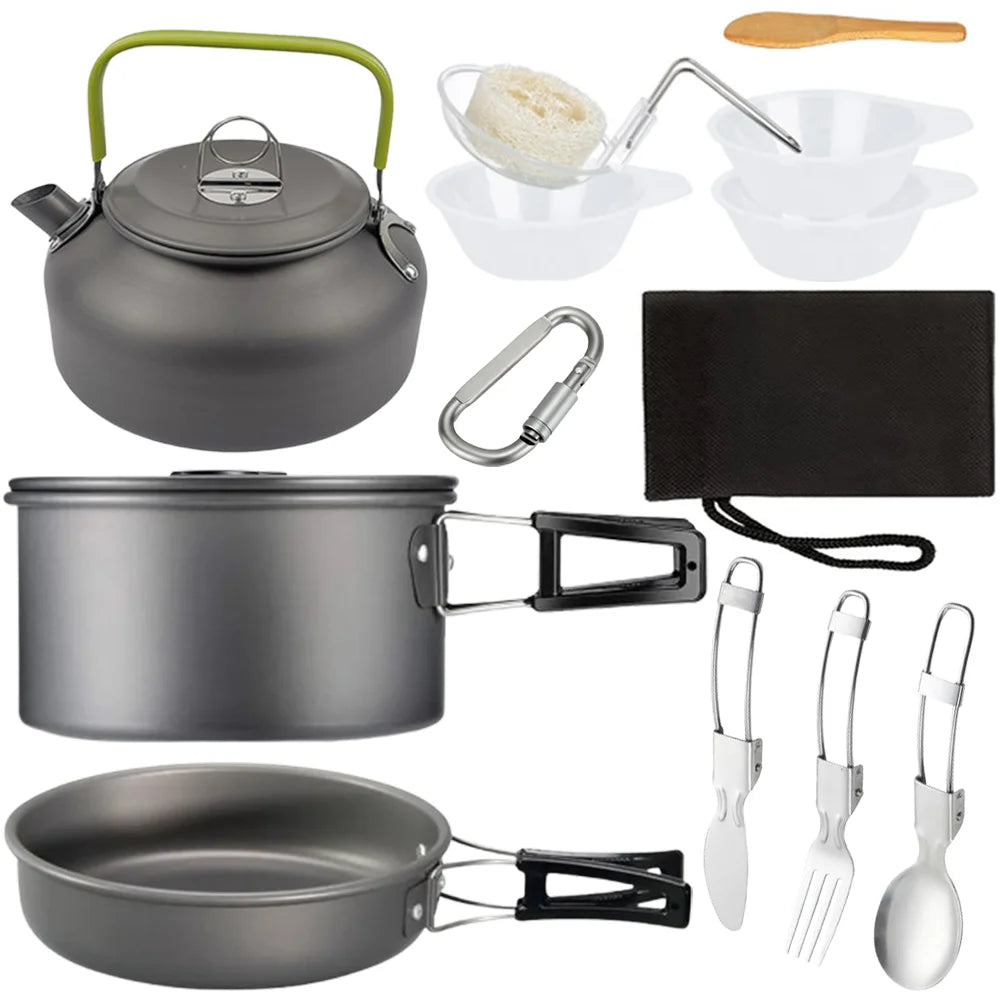 Aluminum camping cookware set with black kettle, pot, pan, white bowls, and utensil set