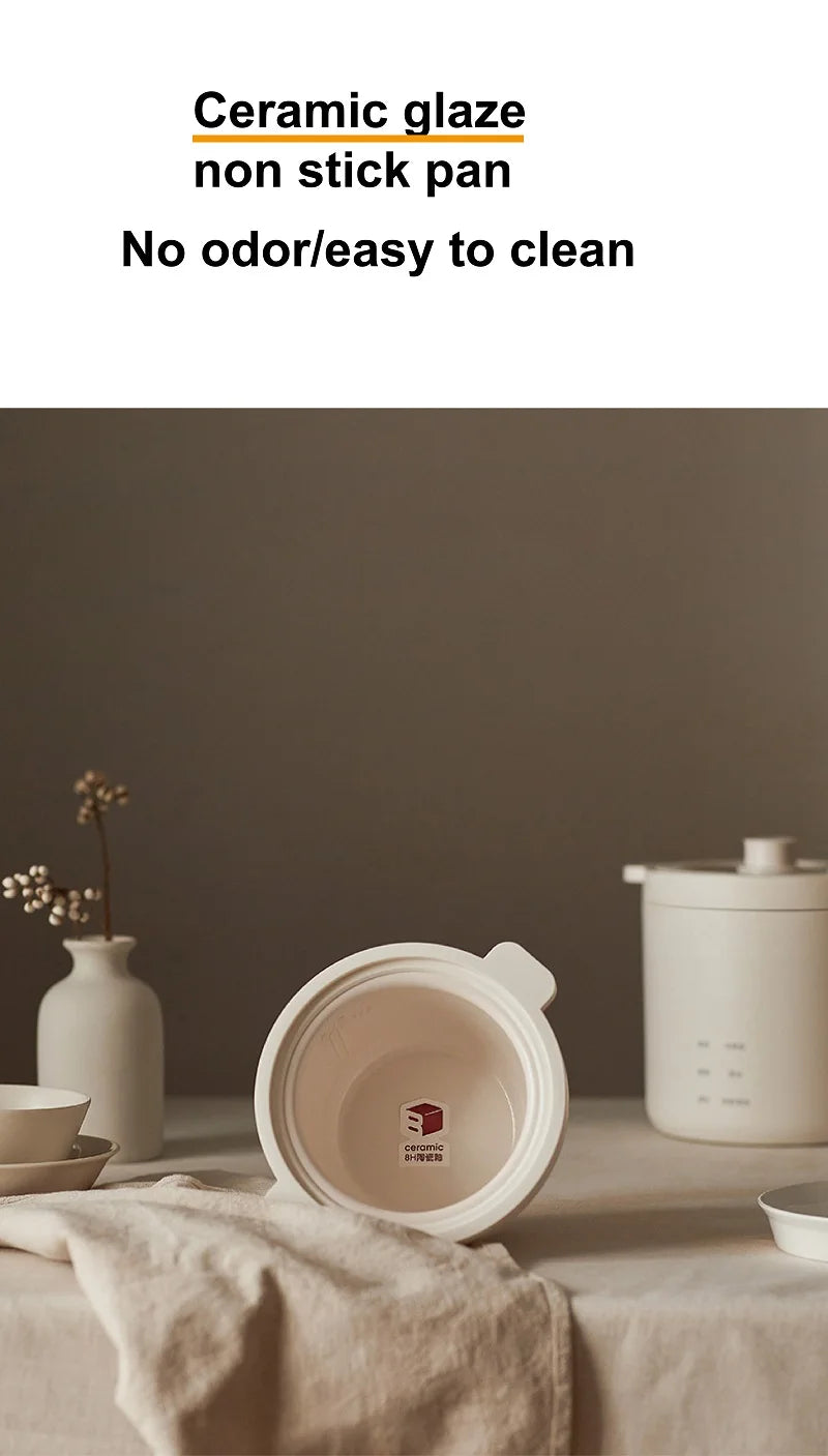 Smart white electric rice cooker with ceramic nonstick pot and lid removed