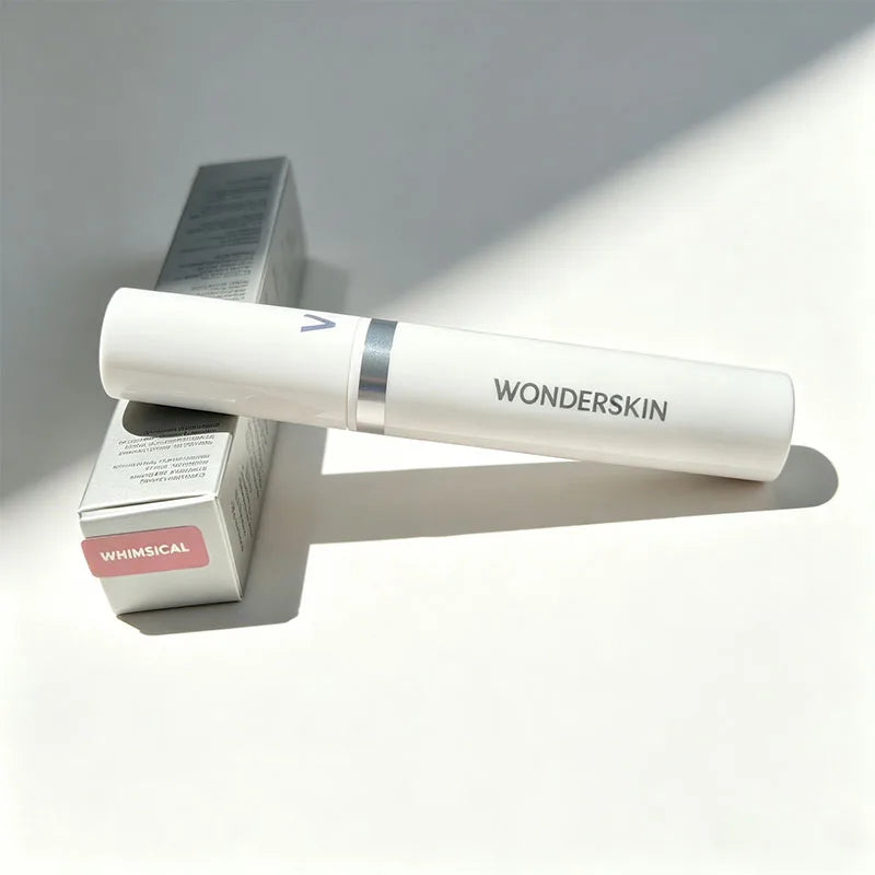 Wonderskin peel-off lip stain in Whimsical pink, long-lasting waterproof lip makeup in sleek white tube with packaging.