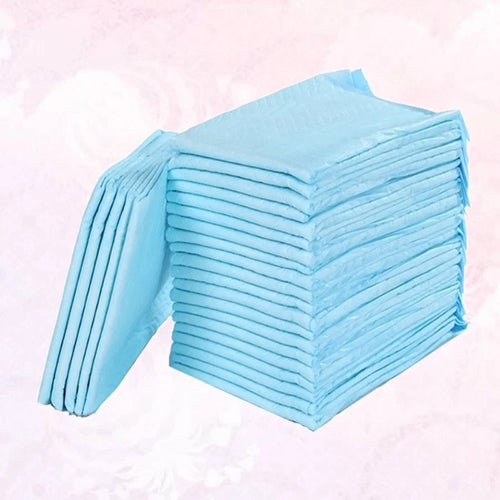 Stack of light blue absorbent baby care underpads for diaper changing protection.