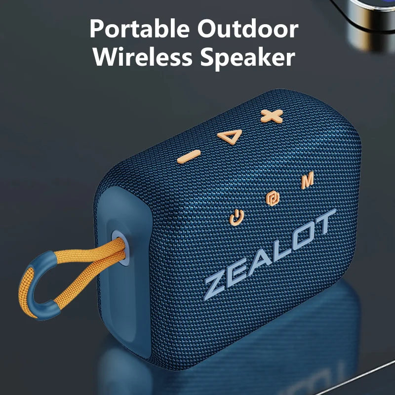 Blue portable wireless speaker with wrist strap, fabric mesh body and ZEALOT logo