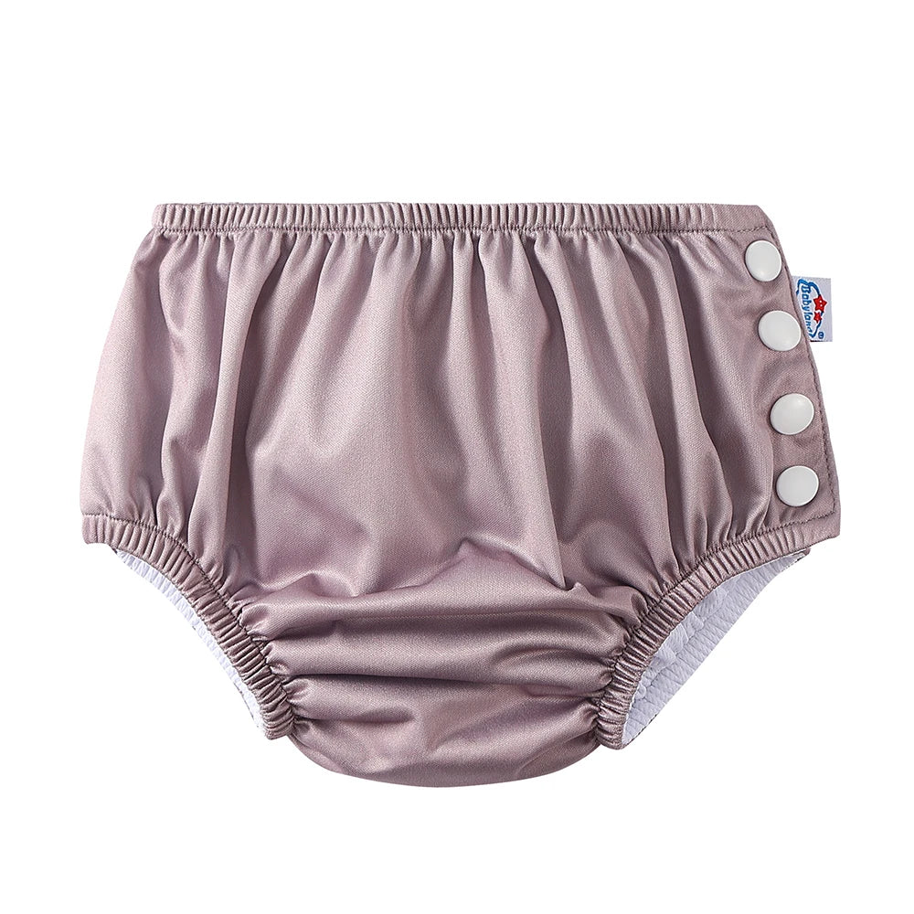 Babyland mauve adjustable cloth diaper for babies with side snap closures.