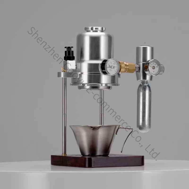 Manual espresso maker with brushed stainless steel finish, pressure gauges, and wood base on white background.