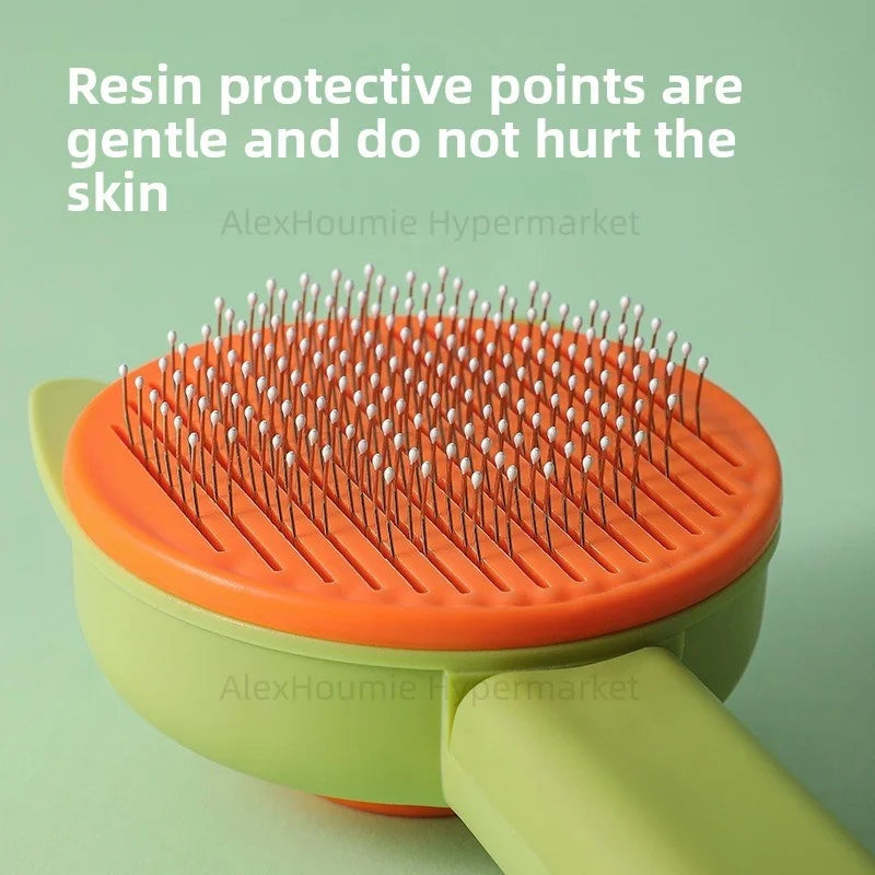 Gentle green and orange pet grooming brush for cats and dogs with resin protective tips for safe hair removal.