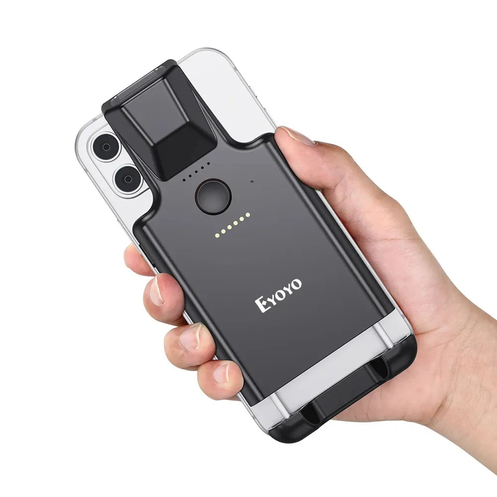 Eyoyo portable 2D barcode scanner with back clip, held in hand on dark body