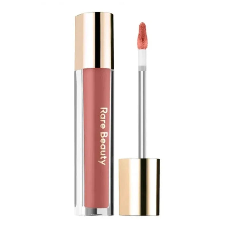Rare Beauty Soft Pinch Tinted Lip Oil with doe-foot applicator in a dusty rose shade with glossy gold cap.