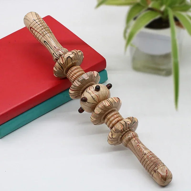 Wooden manual massage roller with textured spinning discs and ergonomic handles for muscle relief and reflexology.