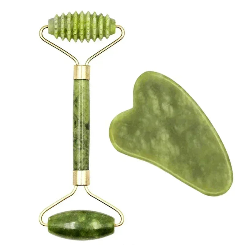 Green jade facial roller with textured and smooth ends, plus a heart-shaped gua sha tool for skin massage.