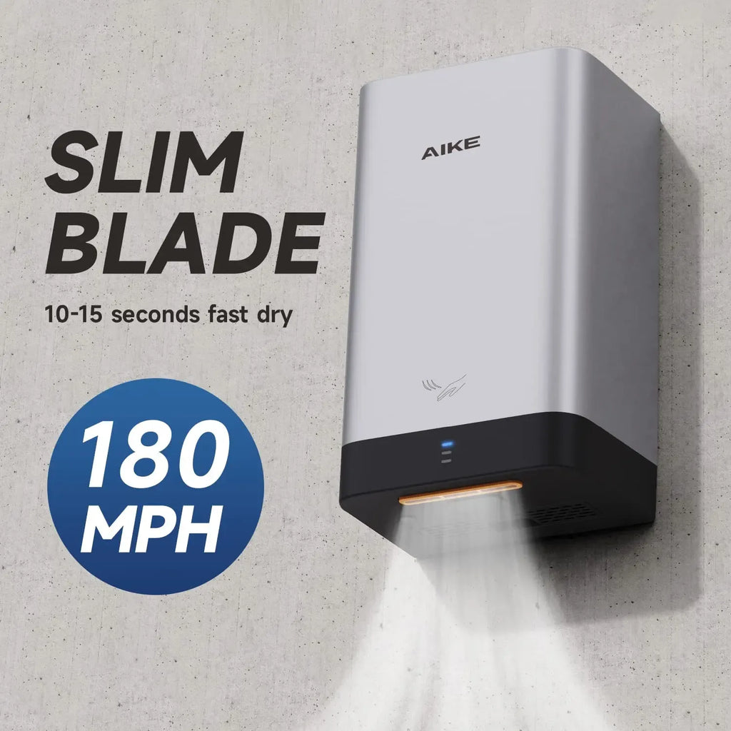 AIKE commercial hand dryer mounted on a concrete wall, featuring a slim silver design with 180 MPH airflow.