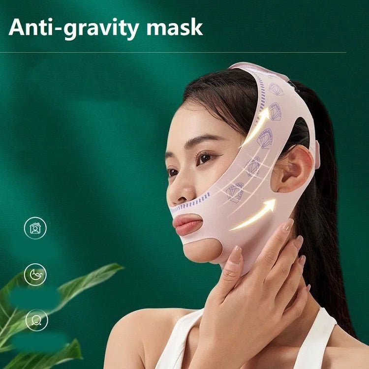 Pink anti-gravity face lifting mask and chin bandage for slimming and V-line shaping on a woman.