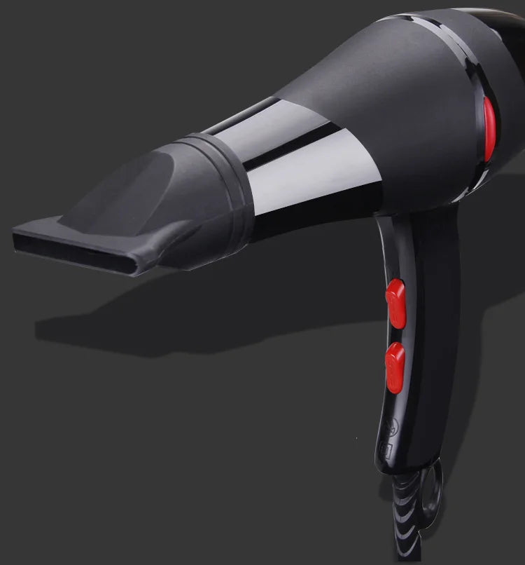 Professional 2100W black hair dryer with concentrator nozzle, red speed buttons, and ergonomic salon design.