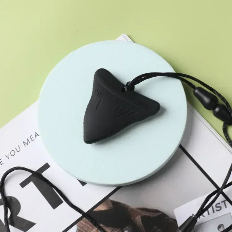 Black silicone teething toy necklace for baby teething relief.
