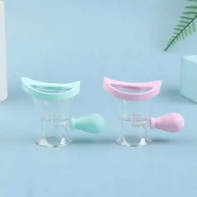 Two reusable soft silicone eye wash cups in blue and pink for gentle eye flushing and rinsing.