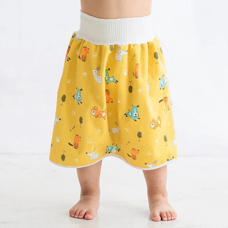 Yellow waterproof baby diaper skirt with cute dog pattern and high waist for easy baby care.