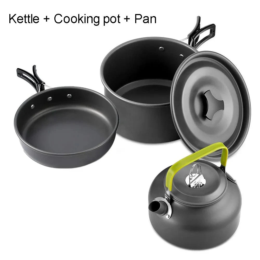 Aluminum camping cookware set with black kettle, pan, and pot plus lime-green handle