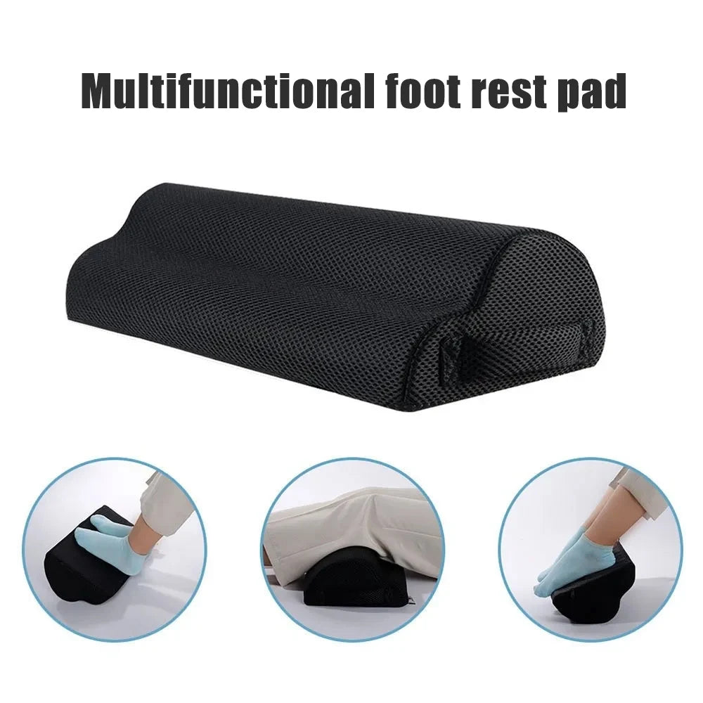 Black memory foam under-desk foot rest with mesh cover for ergonomic office, home, and car foot and leg support.