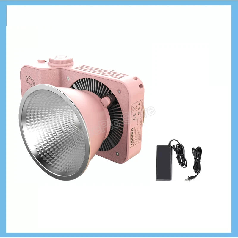 Pink LED video light with a textured finish, large reflective bowl, and external power adapter.