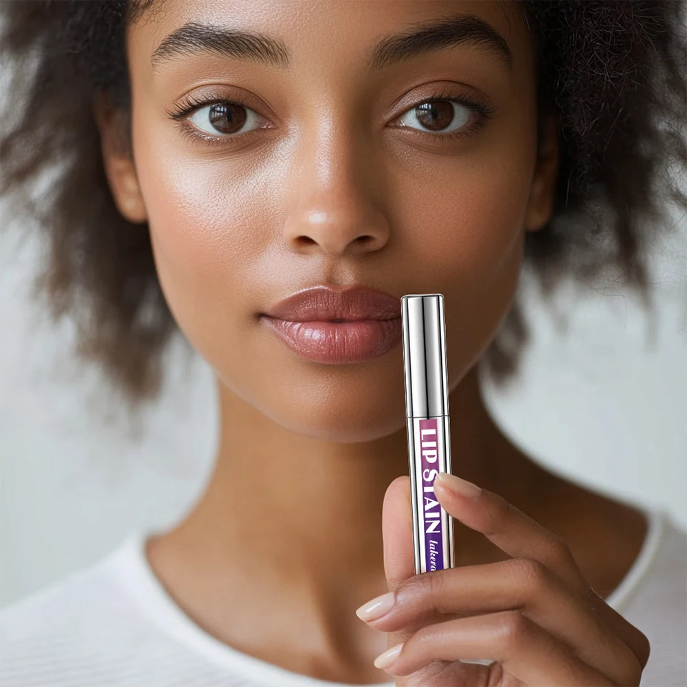 Model holding a waterproof, matte peel-off lip stain tube for long-lasting, transfer-proof lip makeup.