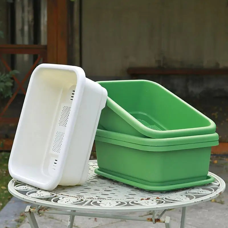 Green rectangular planter with white insert pot and perforated side holes