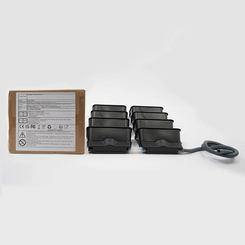 Planter component set with black pots, gray tubing, and shipping box with label