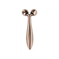 Rose gold Y-shaped facial massager with two faceted, rotating spherical rollers on a sleek, metallic handle.