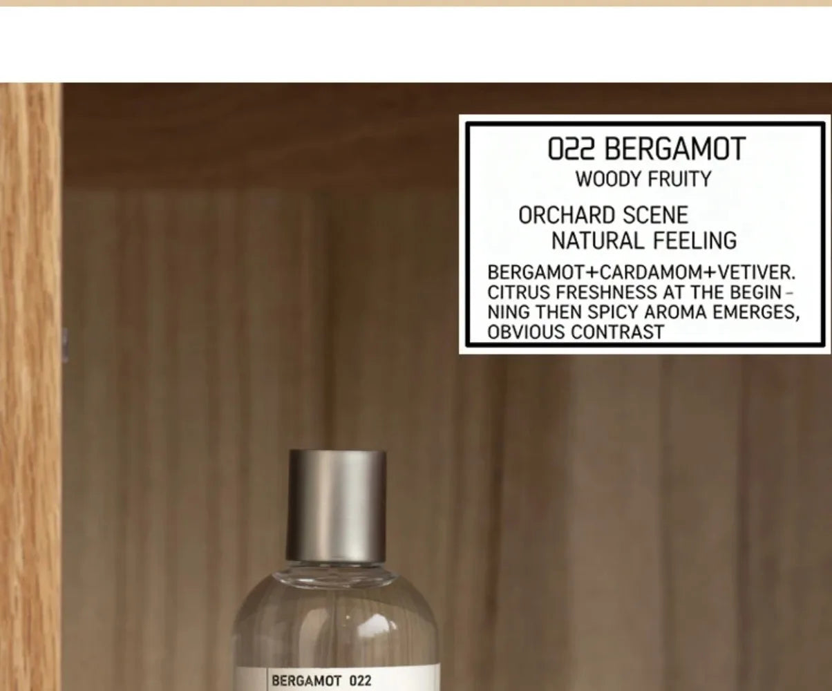 022 Bergamot unisex EDT: 100ml woody fruity perfume with bergamot, cardamom, and vetiver in a sleek clear bottle.