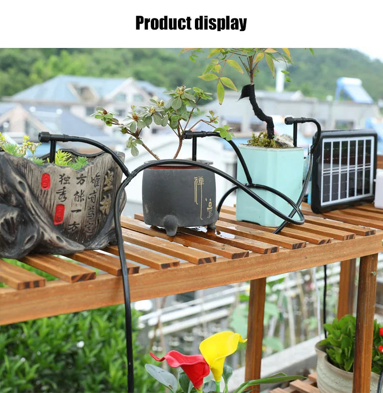 Black drip irrigation kit on a raised plant table with multiple hose micro drippers