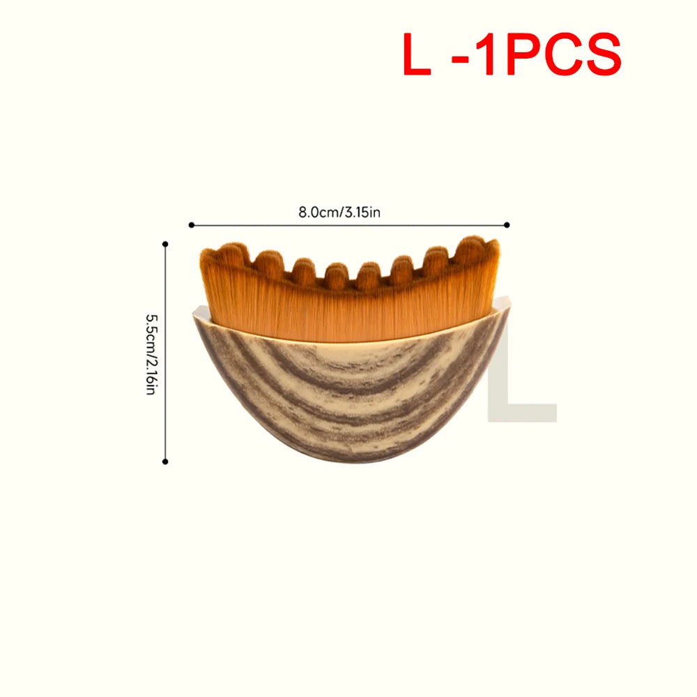 Curved facial massage brush with tan bristles and a brown wood-grain effect handle, shown with dimension labels.