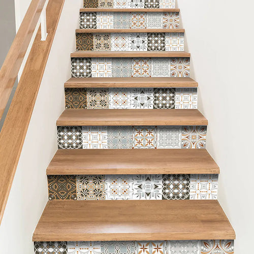 Peel-and-stick backsplash tile set with white, brown, and gold geometric patterns