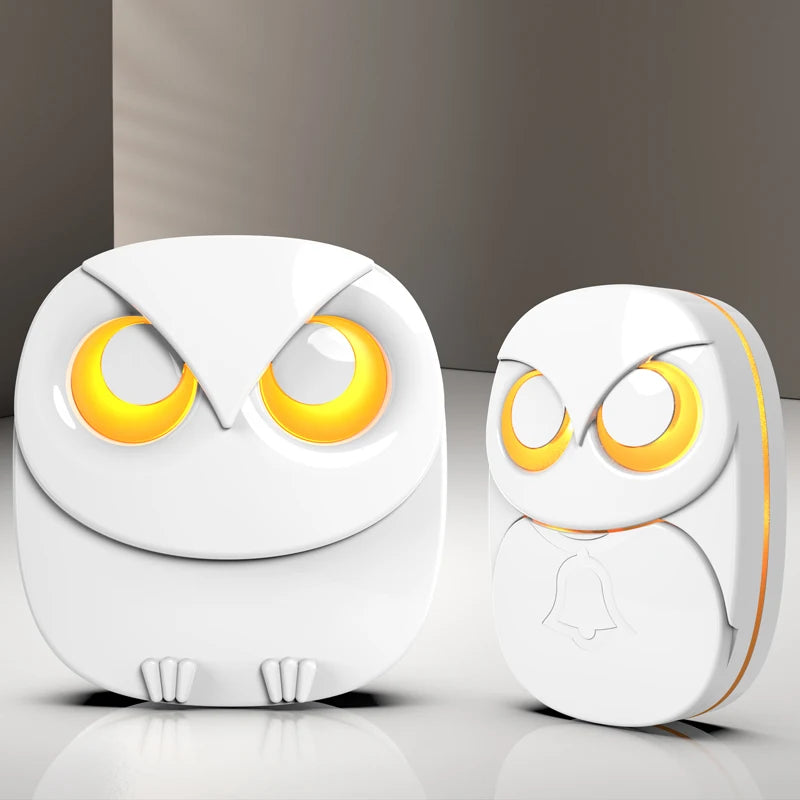 Wireless doorbell chime set with two white owl-style chime units, glowing yellow eyes