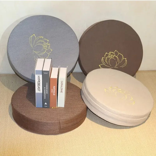 Round meditation cushions in grey, brown, and beige fabric for mindful yoga practice and zen floor seating.