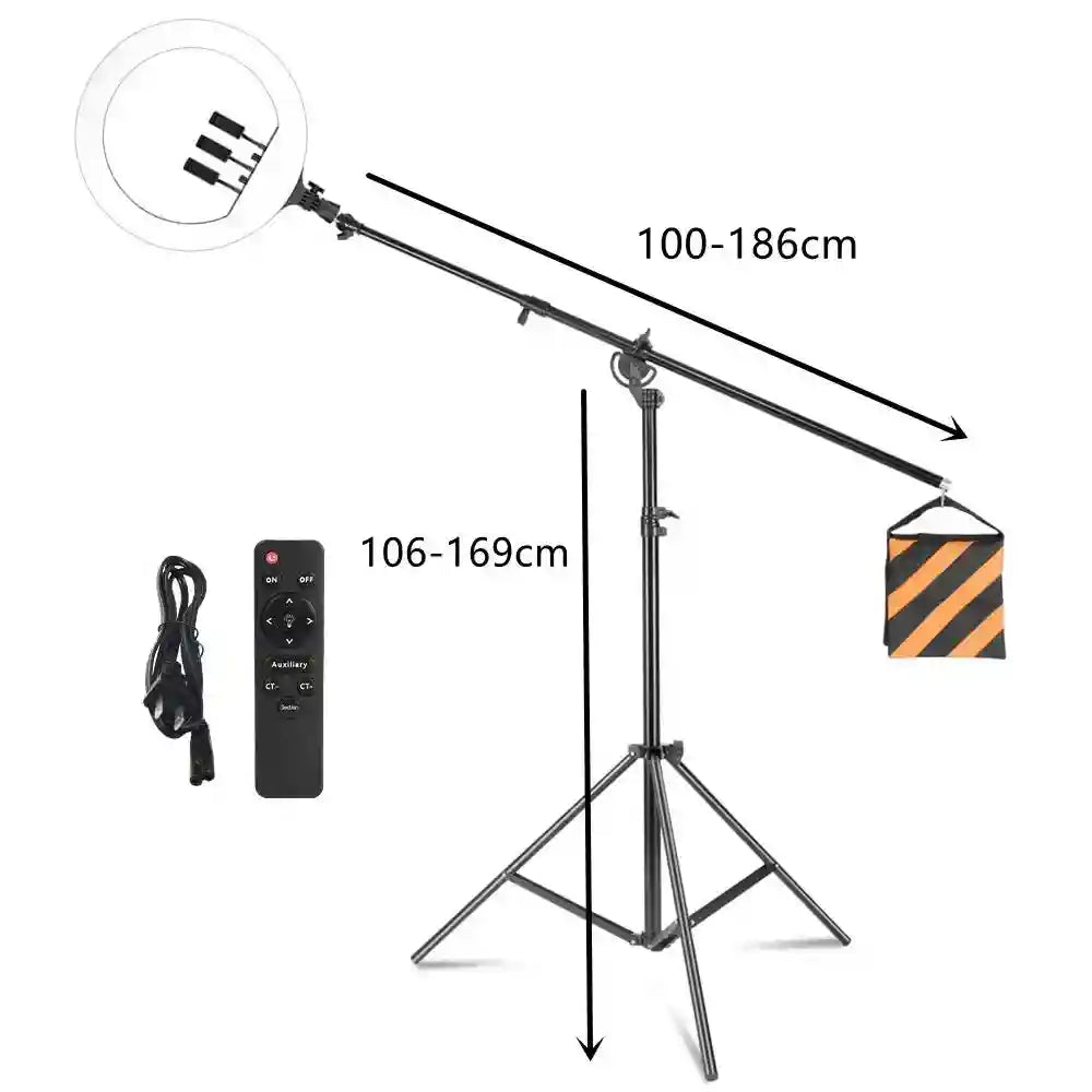 Ring light on adjustable boom arm stand with tripod base, counterweight sandbag, power cord, and remote control.