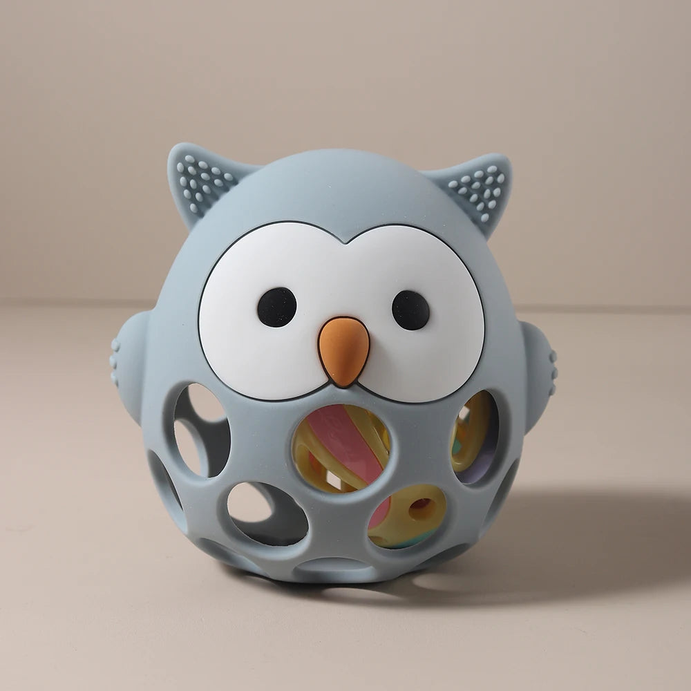 Blue owl silicone baby teething toy with rattling interior for soothing gum relief.