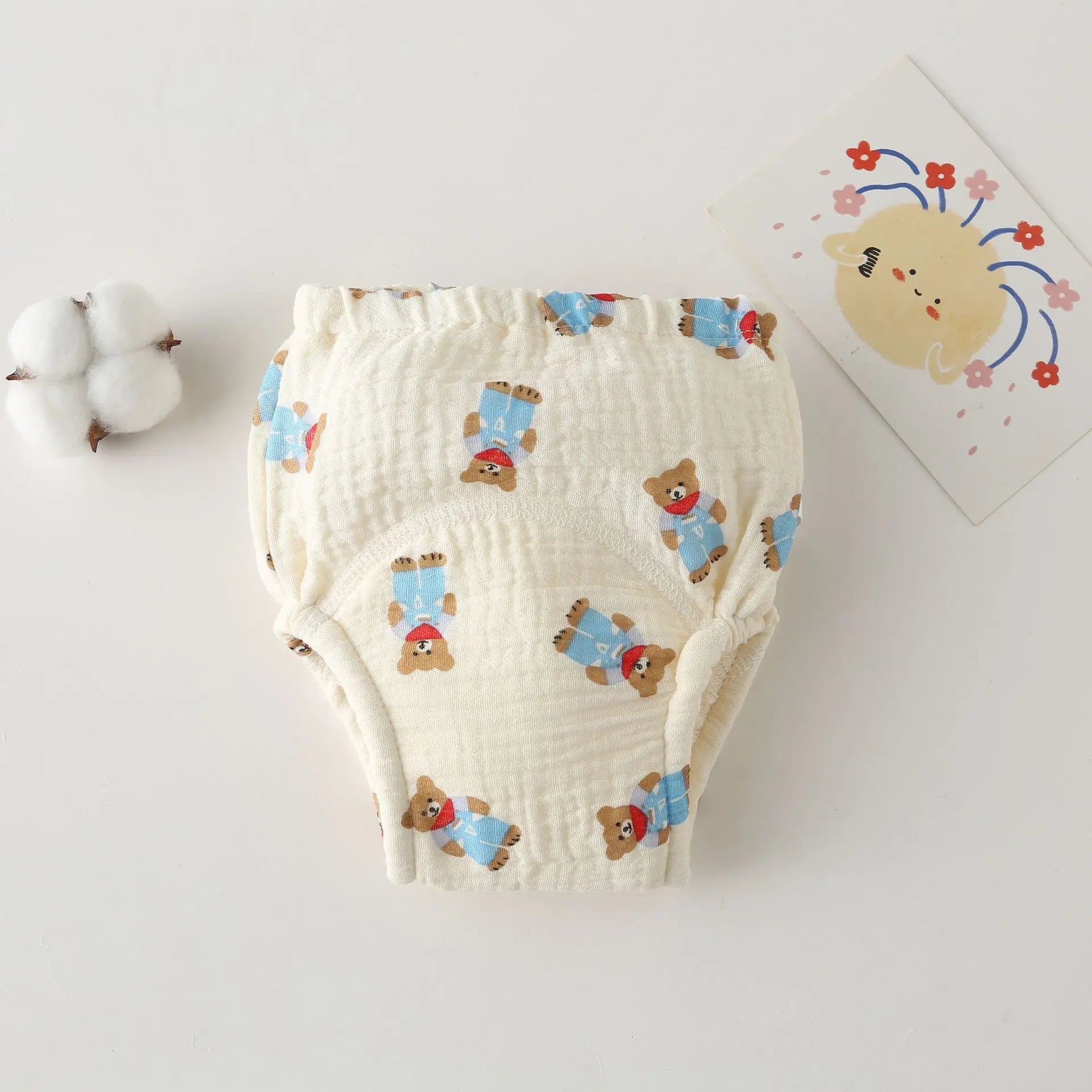Soft muslin baby training diaper with cute bear print and elastic waist for comfort. Essential baby care item.