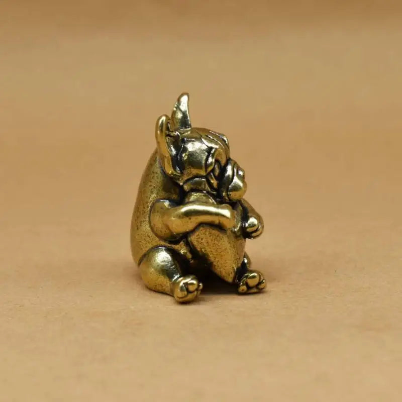 Small antique brass puppy ornament, solid metal dog figurine for tea pet decor or cute desktop decoration.