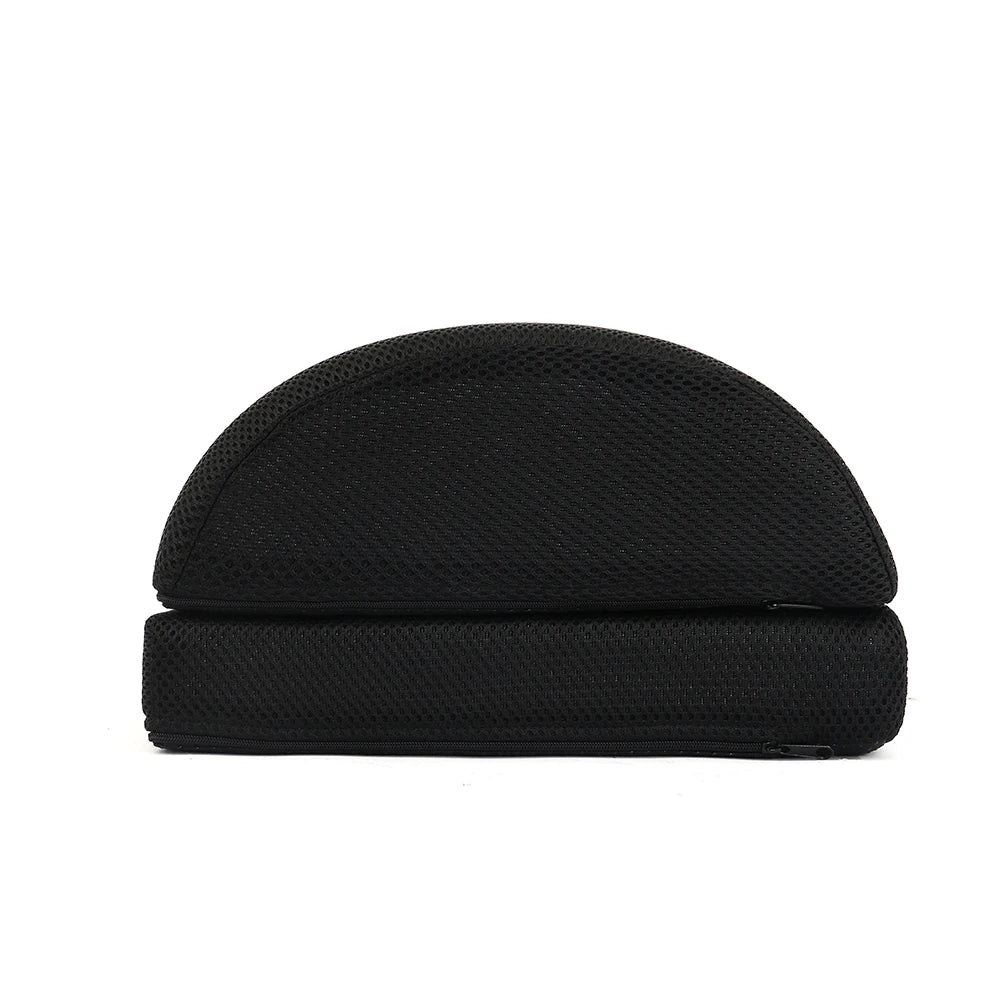 Ergonomic black foam under desk foot rest with mesh fabric cover and adjustable dual-layer design for office comfort.