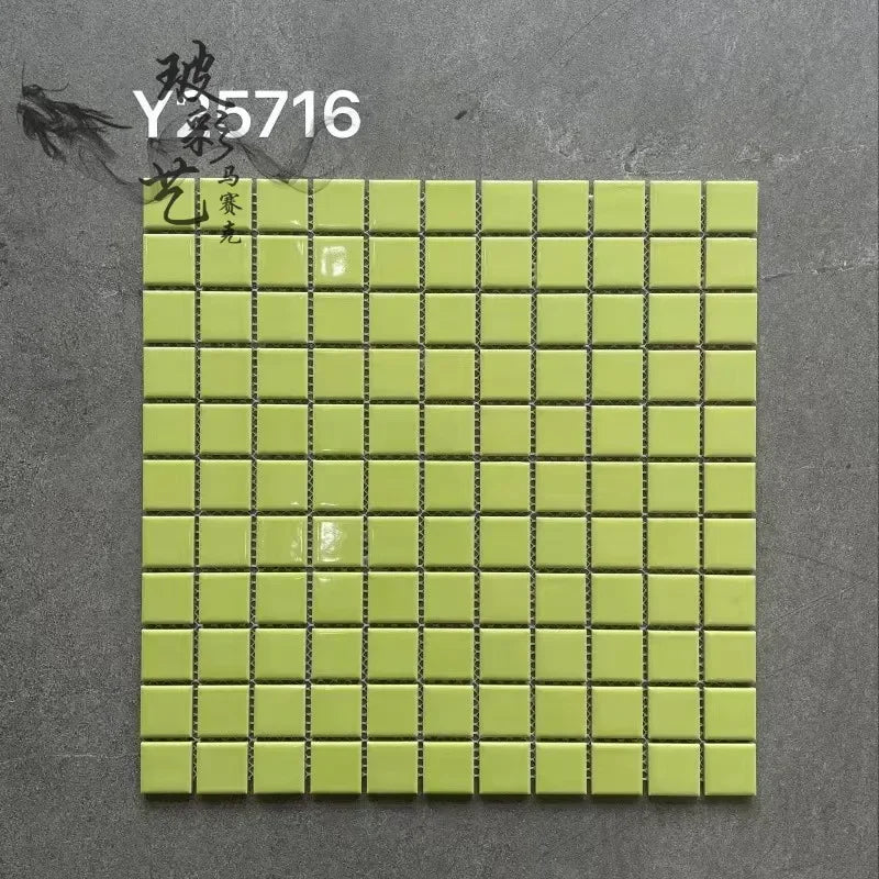 Ceramic mosaic tile sheet with lime green squares and dark grout lines