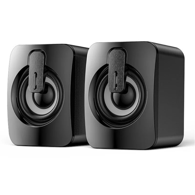 Pair of black mini speakers with circular woofers and top power switches (RGB off)