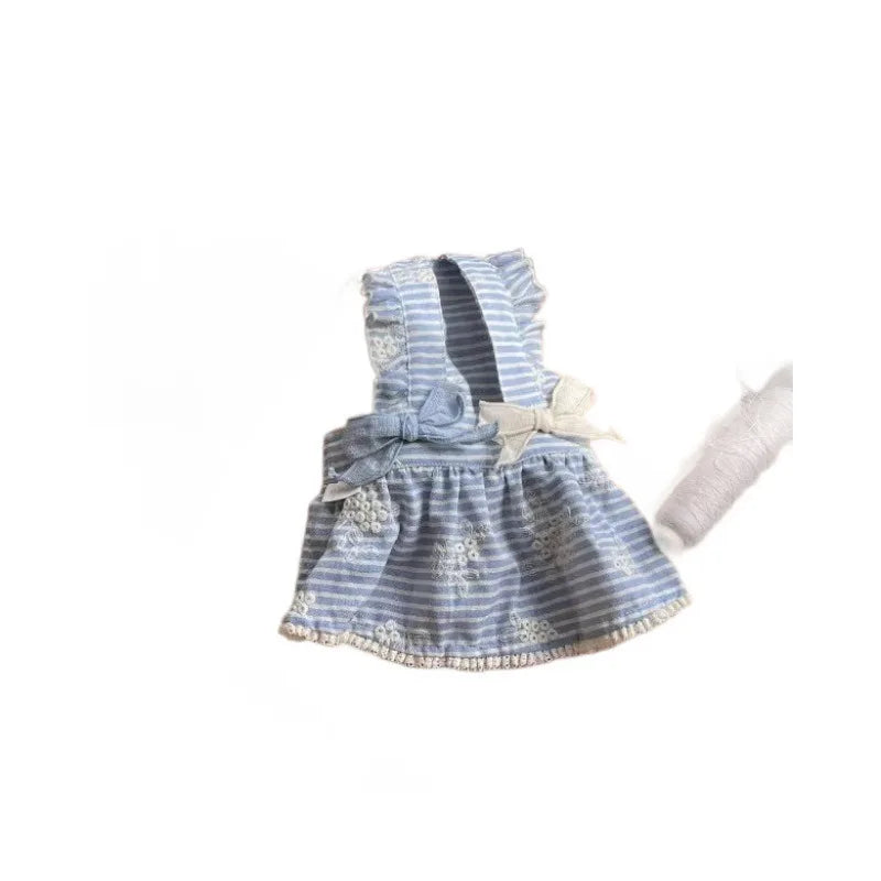Cute blue and white striped dog dress with bows for small dogs. Stylish spring and summer pullover pet outfit.