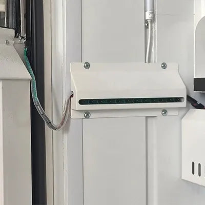 Vending machine internal cooling unit and wiring near the cabinet wall